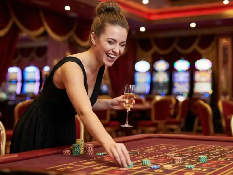 Happy woman placing roulette bets during a color rush game inside a casino